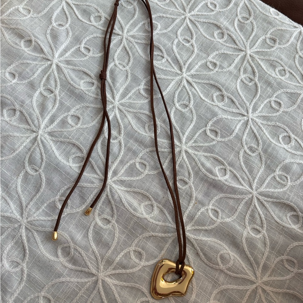 Elegant Gold Sculpture Long Pendant Necklace on Brown Cord - Picture 7 of 9